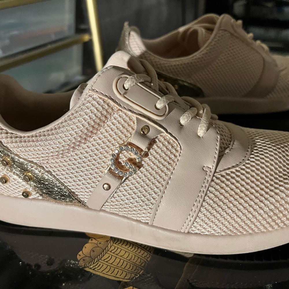 Guess light pink shoe lace up sneakers with golden G and spikes in size 7.5